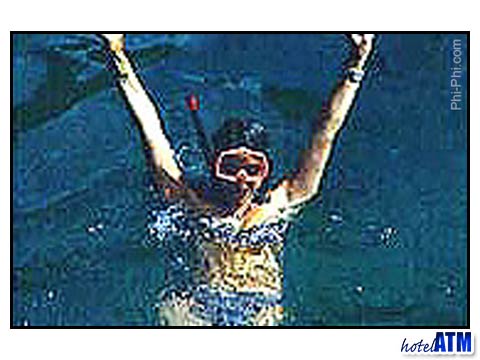 Girl in a bikini snorkeling at Phi Phi Island