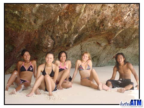 Girls chilling on the beach at Phi Phi's Maya Bay