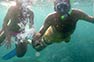 Snorkeling couple holding hands at Phi Phi Island