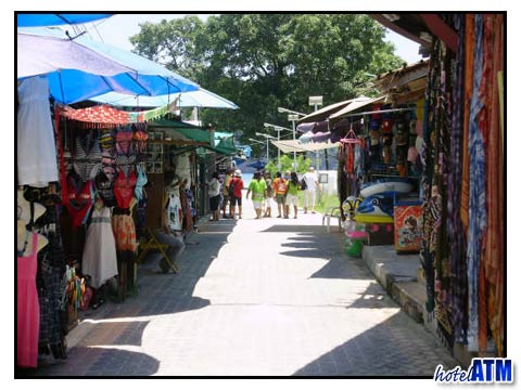 Souvenir shops sveltering in the August weather of Phi Phi