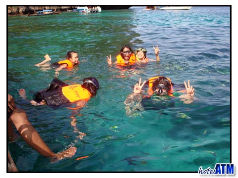 Snorkeling with reef fish at Loh Samah