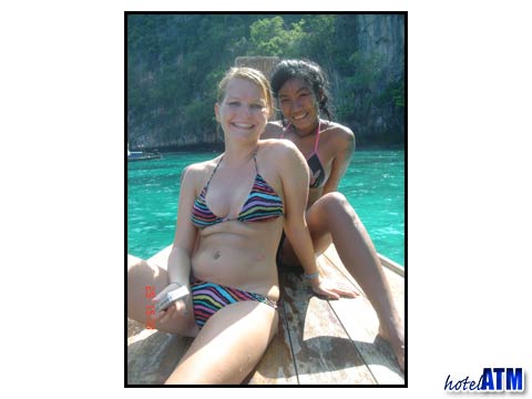 Swimsuit girls on a Thai longtail boat near Phi Phi