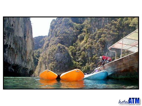 Longtail Taxi Boats and kayaks at Phi Phi