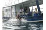 Jumping from the dive boat into the water with Phi Phi Aquanauts Scuba