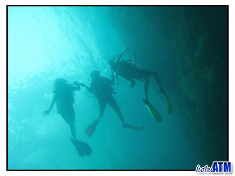 Divers exploring the Koh Bida divesite near Phi Phi