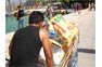 Pushing beer crates on a handcart in Phi Phi