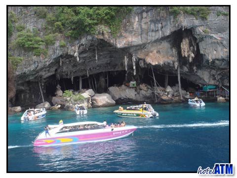 Phi Phi Cruiser Ferry passes Viking Cave on Phi Phi Ley